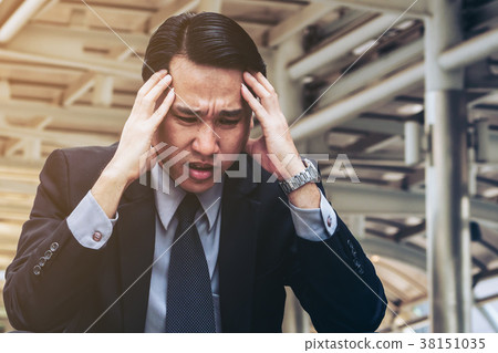 Desperate businessman sitting hopelessly on stair floor Desperate businessman sitting hopelessly on stair floor 38151035