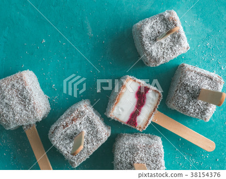 Lamington ice cream pops on blue, top view 38154376