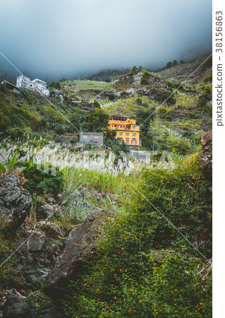 Local dwellings built on the mountain cliffs Local dwellings built on the mountain cliffs 38156863