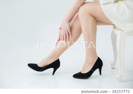Woman touching beautiful legs 38157772