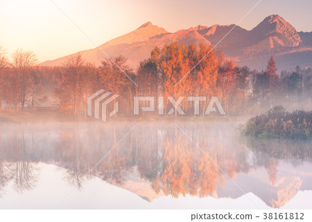 Sunrise light hits high mountains peaks in Tatra Sunrise light hits high mountains peaks in Tatra 38161812