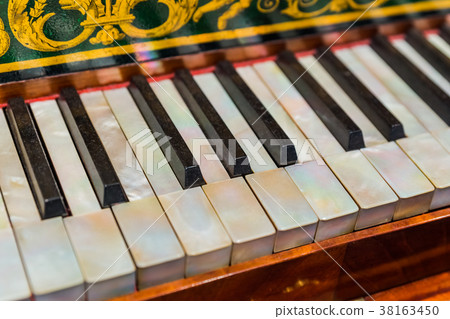 Vintage piano keyboard - music background Vintage piano keyboard - music background 38163450