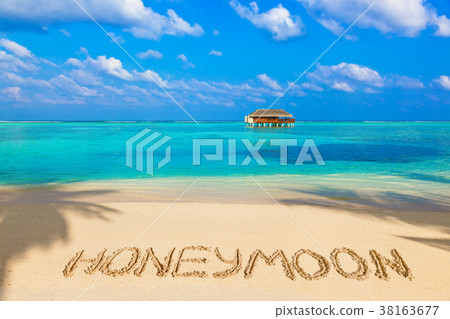 Word Honeymoon on beach 38163677