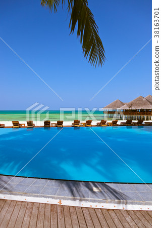 Pool and cafe on Maldives beach 38163701