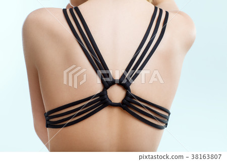 Female back in bra straps, close-up 38163807