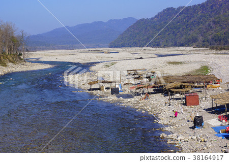 Settlements on the river bank with shantis or huts 38164917