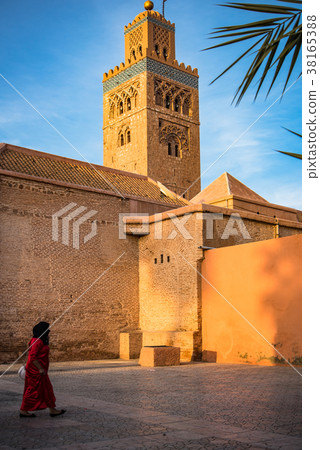 Muslim woman walk by Koutoubia Mosque,Morocco 38165388