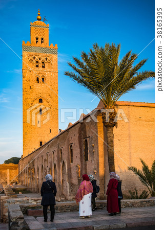 Muslim woman looking at Koutoubia Mosque,Morocco 38165395