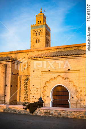 Moroccan Berber sitting by Koutoubia Mosque 38165397