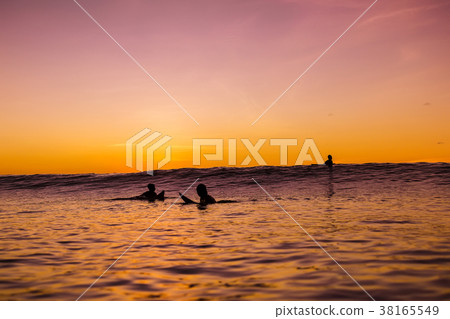 Sunset in Bali and surfers waiting for wave 38165549