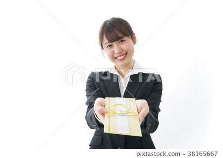 Woman in suit passing a congratulatory bag Woman in suit passing a congratulatory bag 38165667