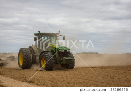 Huge tractor removes the field from the remains of Huge tractor removes the field from the remains of 38166256