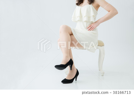 Beautiful legs woman sitting in a chair 38166713