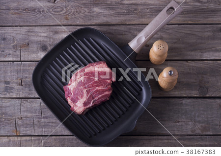 Top view of raw beef steak on grill pan. Receipt Top view of raw beef steak on grill pan. Receipt 38167383