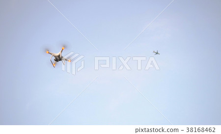 Hexacopter drone flies in the blue sky Hexacopter drone flies in the blue sky 38168462