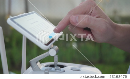 Monitor and control panel drone. Man using a Monitor and control panel drone. Man using a 38168476
