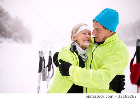 Senior couple cross-country skiing. Senior couple cross-country skiing. 38169262