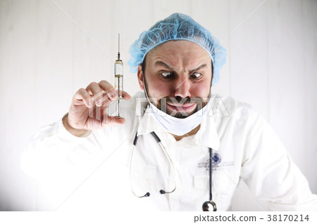 Crazy bearded doctor in a white coat and old Crazy bearded doctor in a white coat and old 38170214