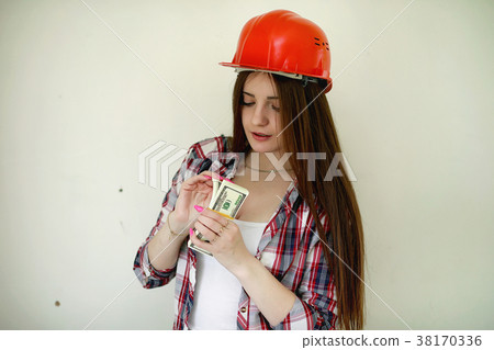 The builder makes repairs in the apartment The builder makes repairs in the apartment 38170336