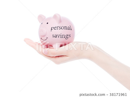 Female hand holds piggy bank personal savings Female hand holds piggy bank personal savings 38171961