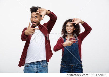 Happy young African American couple looking Happy young African American couple looking 38172008