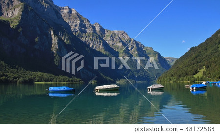 Summer day at lake Klontalersee, Switzerland. Summer day at lake Klontalersee, Switzerland. 38172583