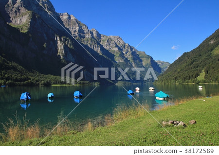 Lake Klontalersee and mountains in Summer. Lake Klontalersee and mountains in Summer. 38172589