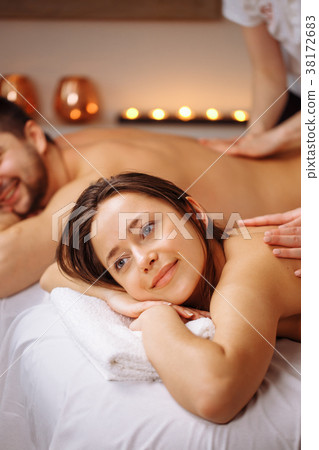 Happy couple getting massage at spa 38172683