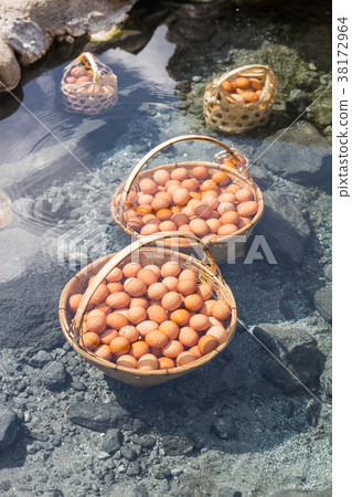 Big baskets of eggs boiled under hot water pond Big baskets of eggs boiled under hot water pond 38172964
