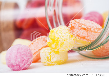 traditional candies in transparent glass container 38173300