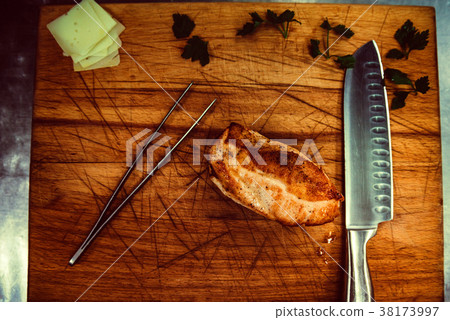 Grilled chicken fillets on wooden cutting board 38173997