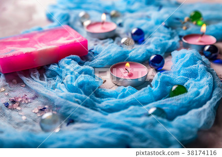 Romantic background with candles, soap and shawl 38174116