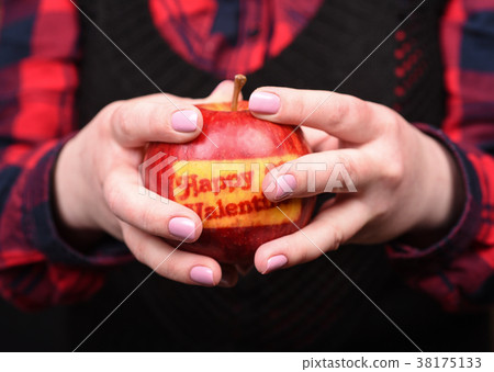 Female hands with an apple. Valentine's Day. Female hands with an apple. Valentine's Day. 38175133