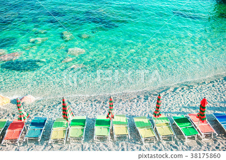 Sunbeds and umbrellas at beautiful european Sunbeds and umbrellas at beautiful european 38175860