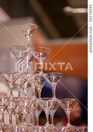 Pyramid of glasses, still empty, for beverages Pyramid of glasses, still empty, for beverages 38176045