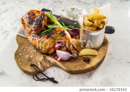 half of appetizing grilled juicy chicken with potatoes 38178342