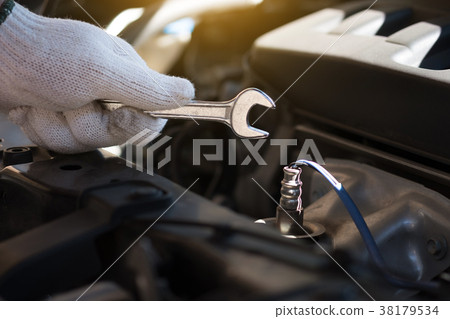 Mechanic repairing a car  in garage  Auto repair  38179534