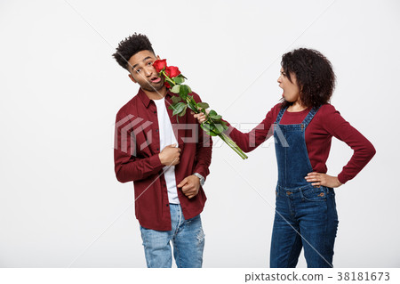 Portrait of a disappointed young woman holding red Portrait of a disappointed young woman holding red 38181673