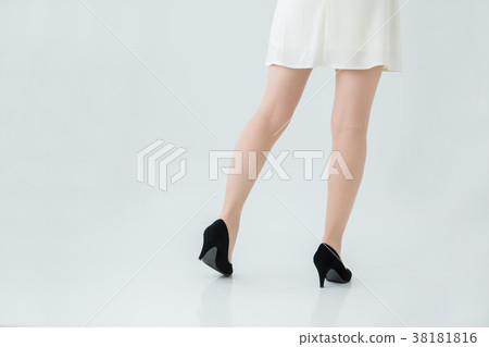 Female legs wearing a skirt Female legs wearing a skirt 38181816