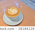 Cup of coffee on the table with latte art. 38184128