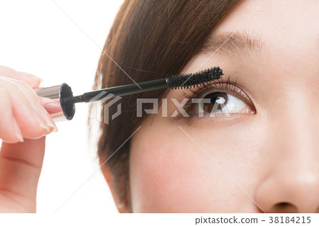 Woman doing makeup, lashes, mascara Woman doing makeup, lashes, mascara 38184215