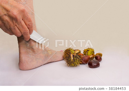 The female leg and hand with medicine cream from The female leg and hand with medicine cream from 38184453