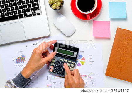 Businessman hand working with financial data Businessman hand working with financial data 38185567