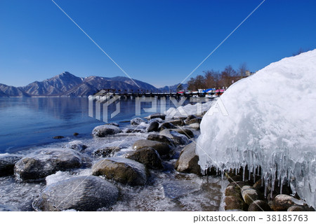 Chuzenji Lake in winter from frozen lake ground frozen shore and icicle a background blur large 38185763