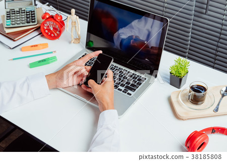 Businessman using smart phone 38185808