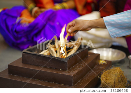 Worshiping Fire. Homa. Hindu marriage ritual Worshiping Fire. Homa. Hindu marriage ritual 38186468