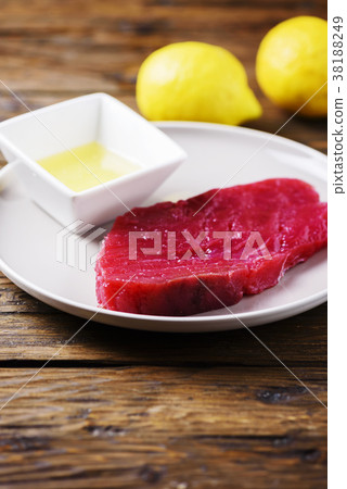 Raw fresh tuna fish on the wooden table Raw fresh tuna fish on the wooden table 38188249