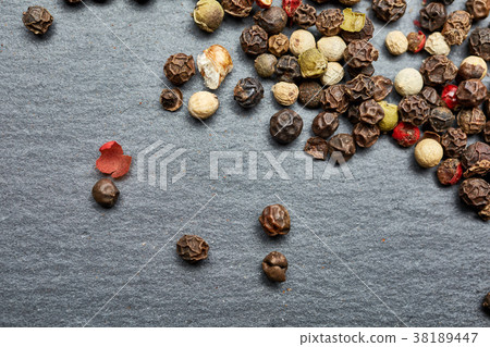 mixture of pepper peas powder scattered on a slate mixture of pepper peas powder scattered on a slate 38189447