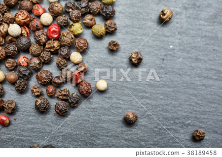 mixture of pepper peas powder scattered on a slate mixture of pepper peas powder scattered on a slate 38189458