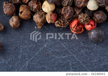 mixture of pepper peas powder scattered on a slate mixture of pepper peas powder scattered on a slate 38190041